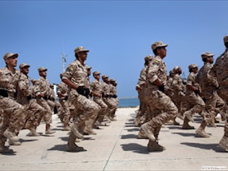 Soldiers of the Libyan National Army parade with their military pick-up vehicles during the graduation ceremony of new batch of the Libyan Navy special forces the Mediterranean sea port of Trip (4)