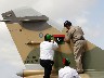 Libyan Air Force Brigadier General Mohammed Rajab (R) replaces the all-green Gaddafi-era Libyan flag on the tail of a Libyan Air Force Mirage F1 fighter jet with a Kingdom of Libya flag  (2)