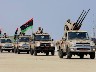 Soldiers of the Libyan National Army parade with their military pick-up vehicles during the graduation ceremony of new batch of the Libyan Navy special forces the Mediterranean sea port of Tripo (1)